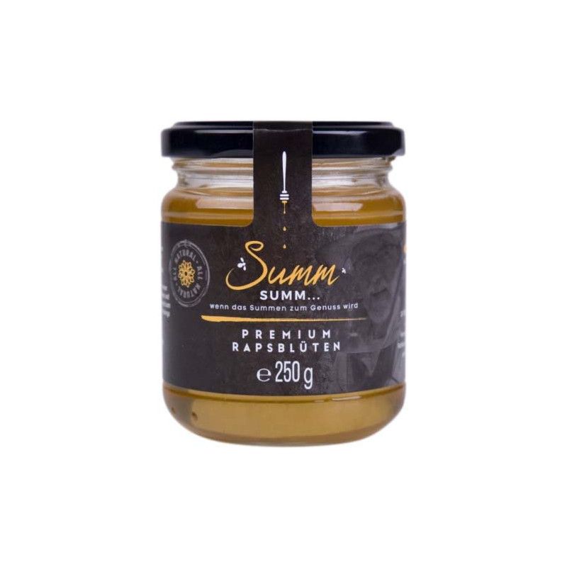 Glas Honig mit schwarzem Deckel und Etikett. Aufschrift: Summ... Premium Rapsblüten, 250g.