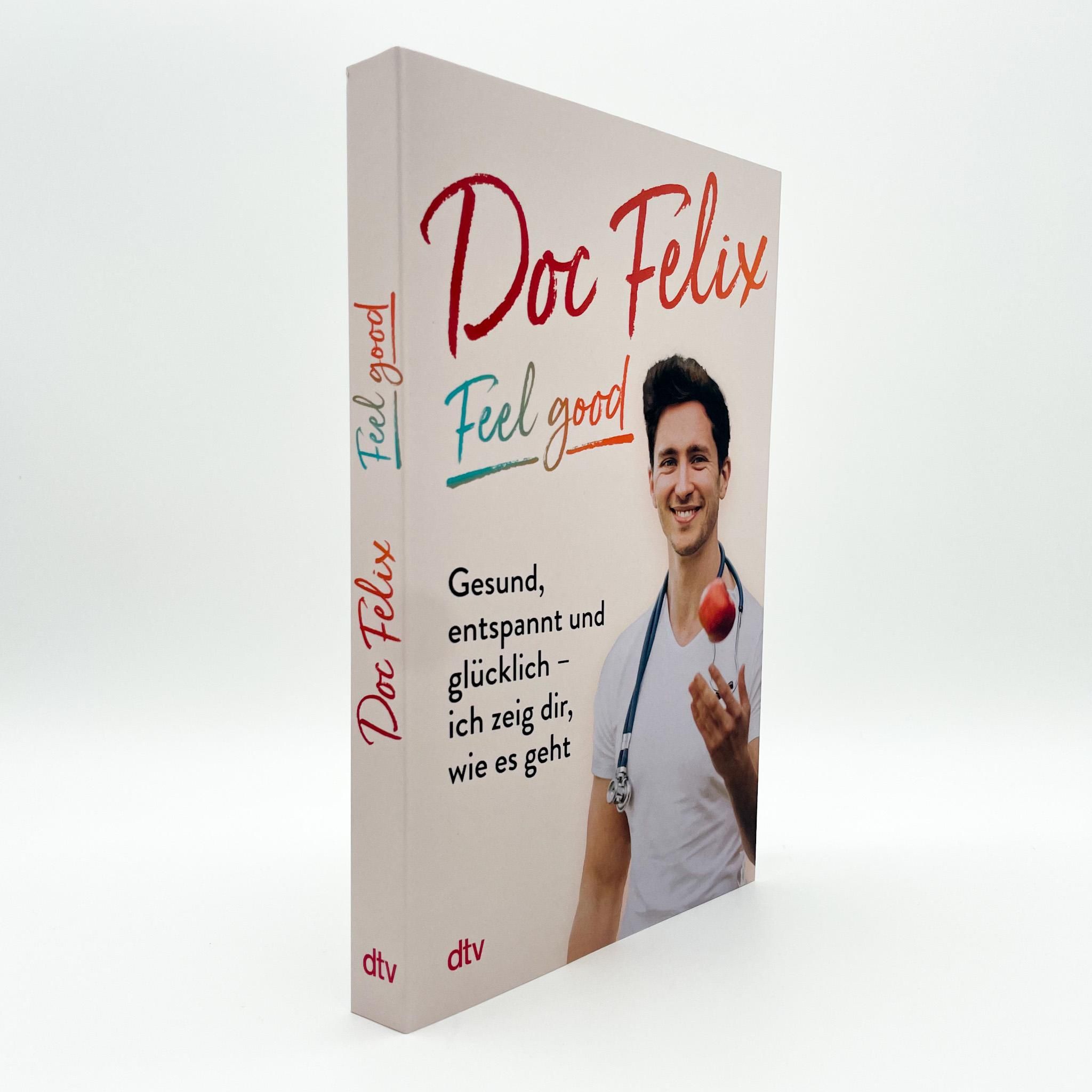 Buch "Doc Felix - Feel good". Cover mit Titel und Mann mit Stethoskop. Buchrücken mit Titel. DTV-Verlag.
