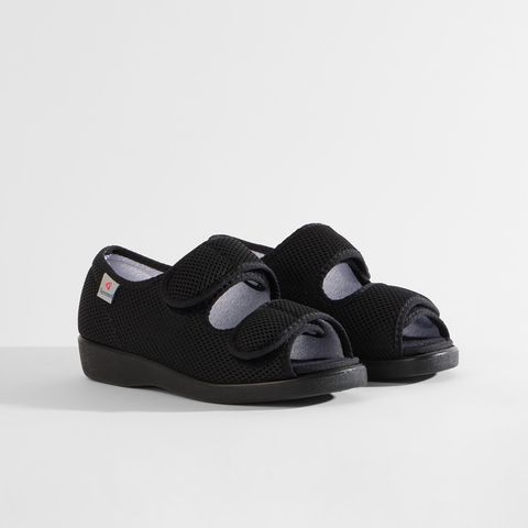 Schwarze Sandalen mit Klettverschluss und atmungsaktivem Mesh-Obermaterial.