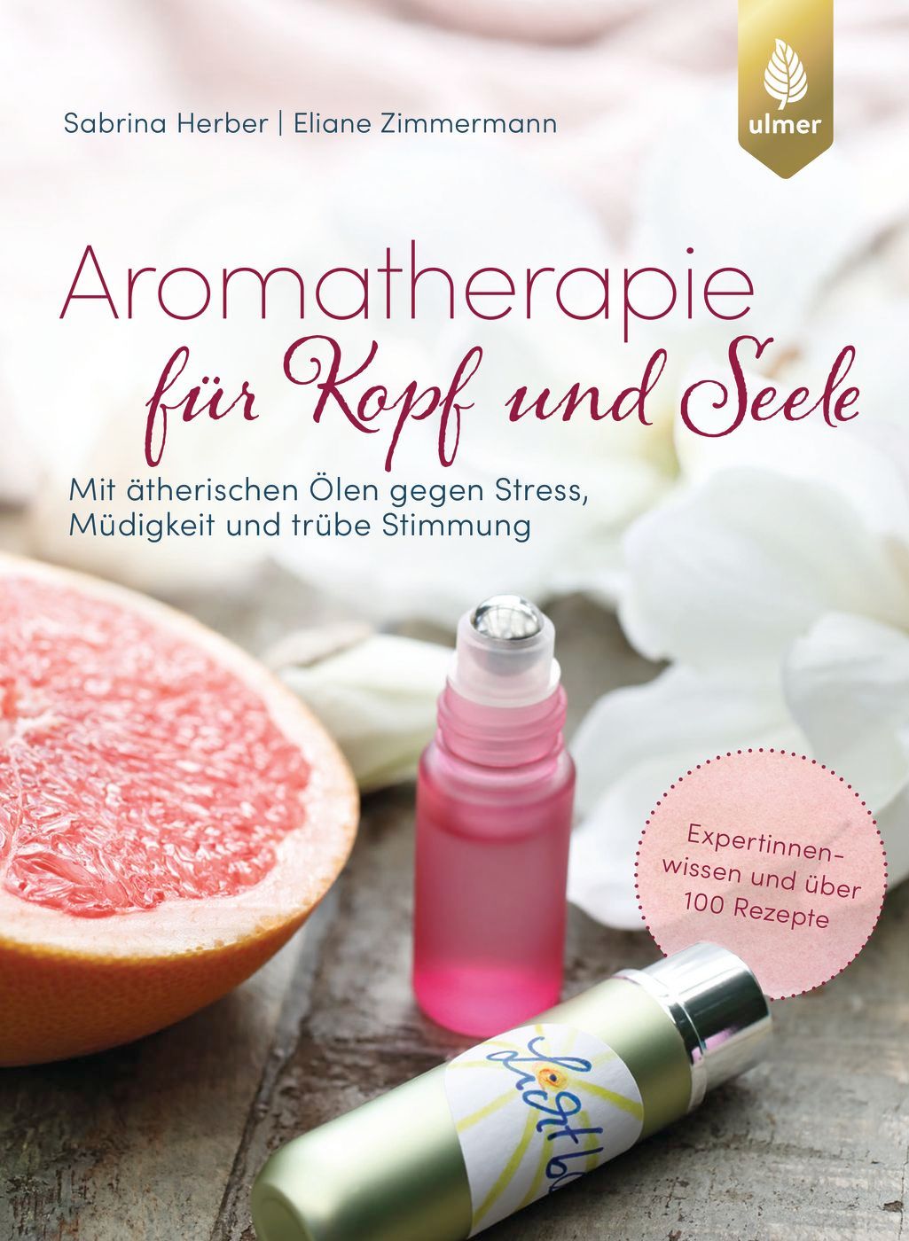 Buchcover mit Titel "Aromatherapie für Kopf und Seele". Autoren: Sabrina Herber, Eliane Zimmermann. Neben Grapefruit und Ölen.
