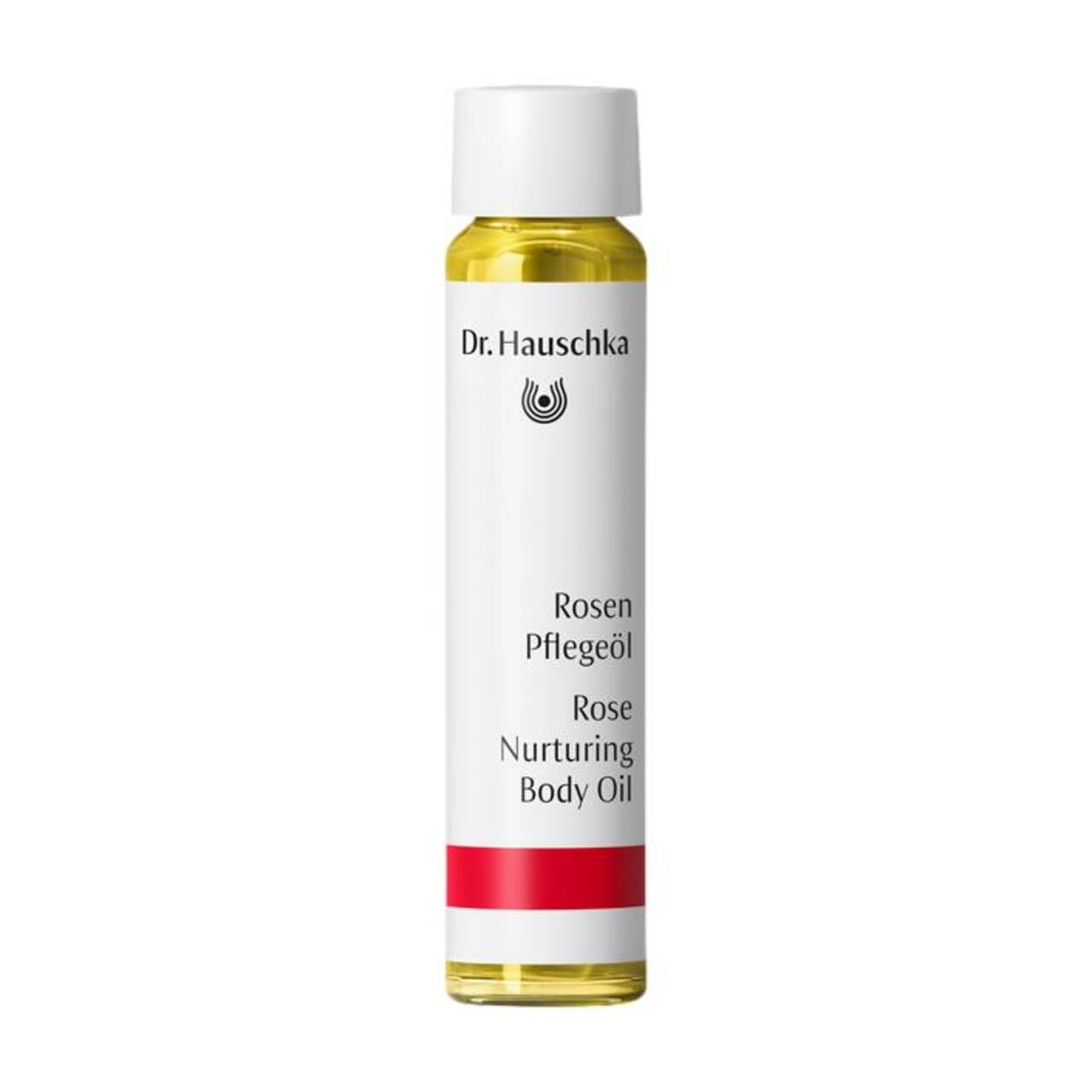 Körperölflasche mit weißem Etikett. Aufschrift: Dr. Hauschka, Rosen Pflegeöl, Rose Nurturing Body Oil. Roter Streifen am unteren Ende.