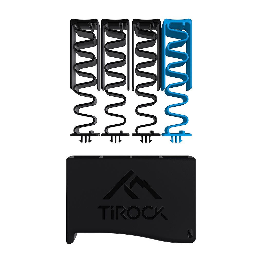 Fingertrainer-Set mit vier Federn, drei schwarz, eine blau. Schwarzer Halter mit TiRock-Schriftzug.