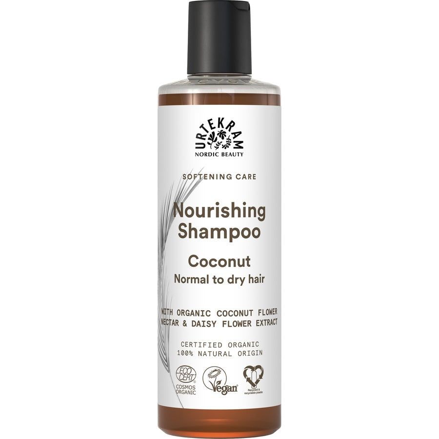 Flasche Shampoo. Aufschrift: Nourishing Shampoo Coconut. Zertifizierungen: Vegan, Cosmos Organic.