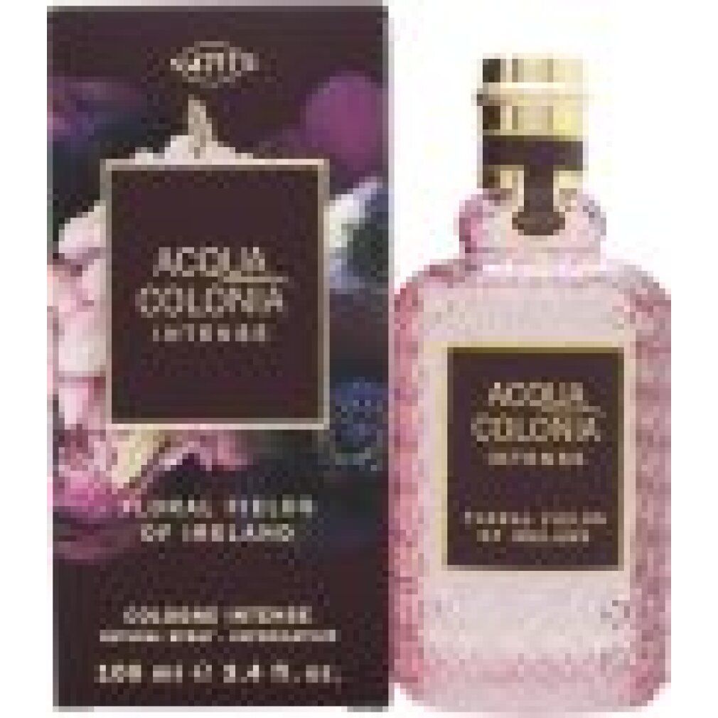 Acqua Colonia Intense Flakon mit goldfarbenem Verschluss, umgeben von lila Blumen.