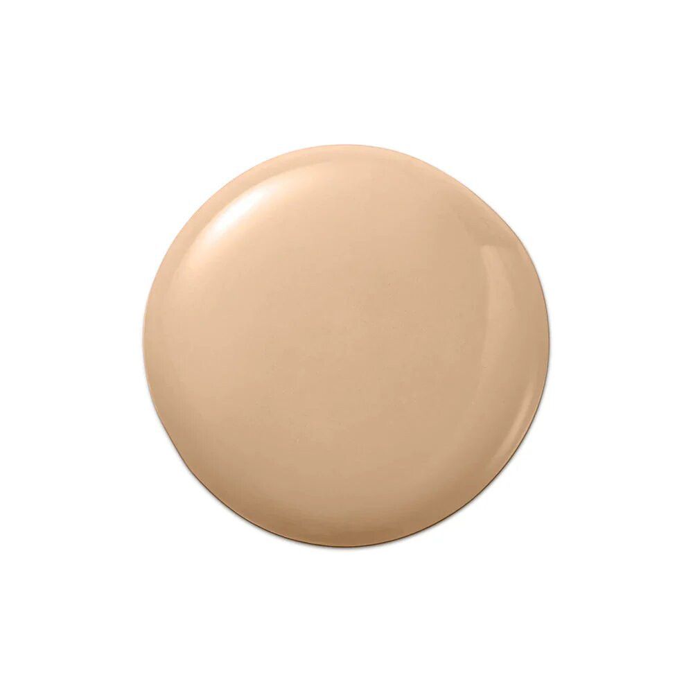 Beige Flüssigkeitstropfen. Glänzende Textur. Auf weißem Hintergrund.