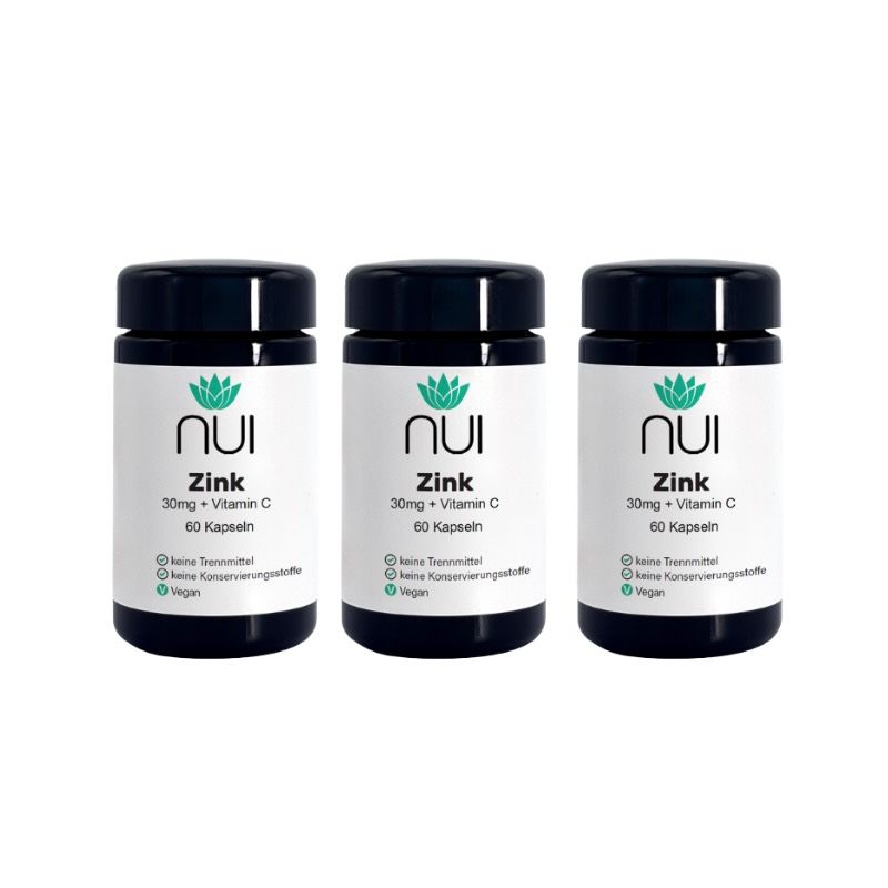 Drei Flaschen NUI Zink plus Vitamin C. Schwarze Deckel, weiße Etiketten mit Logo und Produktinformationen.