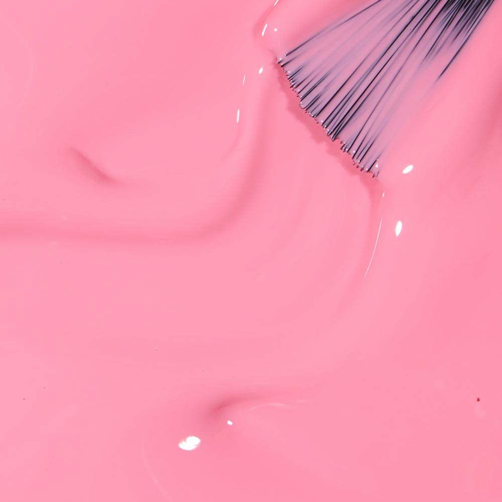 Rosa Nagellack mit Pinsel. Nahaufnahme. Glänzende Textur.