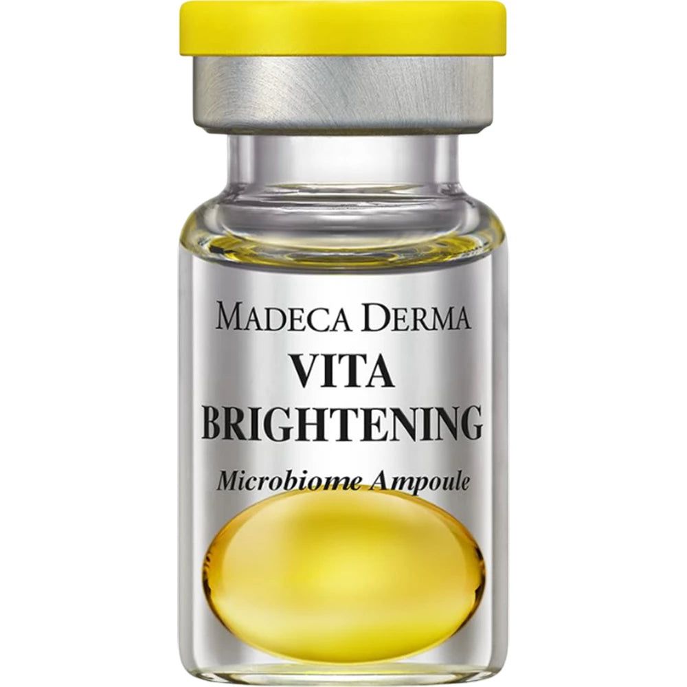 Eine Flasche MADECA DERMA Vita Brightening Microbiome Ampoule mit gelbem Verschluss und silbernem Kragen.