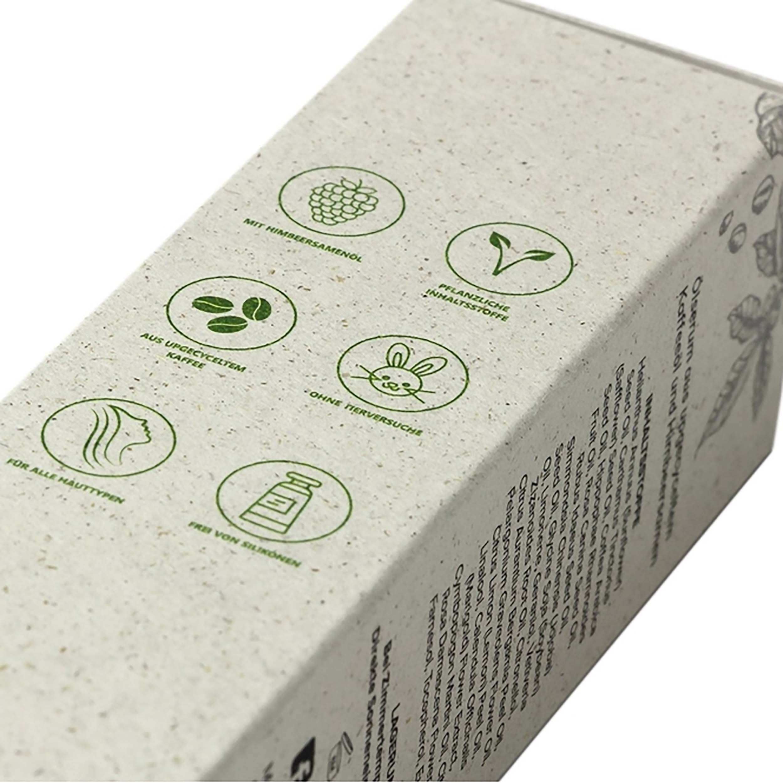 Nahaufnahme der Verpackung. Symbole für Himbeersamenöl, pflanzliche Inhaltsstoffe, vegan, tierversuchsfrei, für alle Hauttypen.