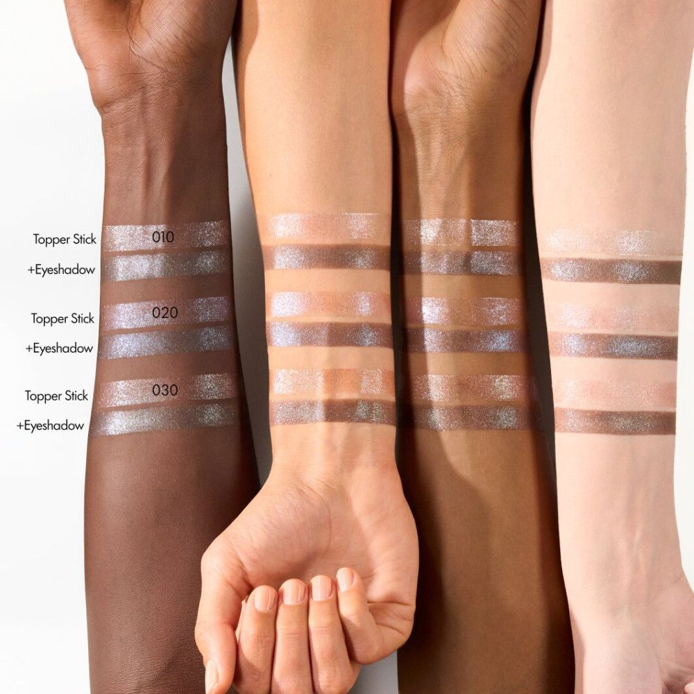 Arme mit verschiedenen Hauttönen zeigen Lidschatten-Swatches. Text: Topper Stick + Eyeshadow, mit Farbnummern.