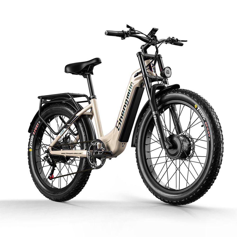 Beige E-Bike mit schwarzen Reifen und Gepäckträger. Marke Shengmilo sichtbar. Frontscheinwerfer und Federung.