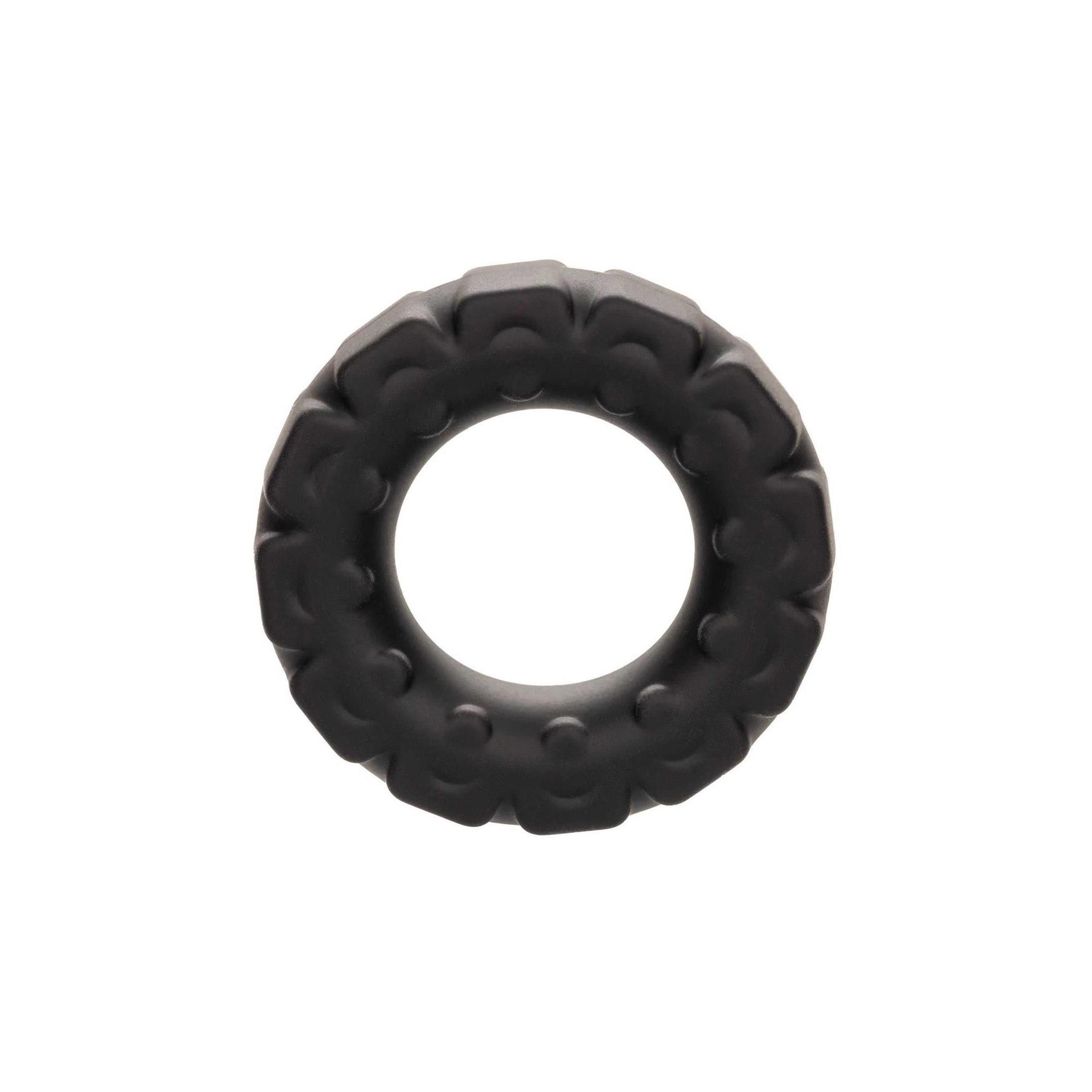 Schwarzer Ring mit erhabener Struktur. Innen glatt, außen mit Noppen und Blöcken. Aus Gummi.