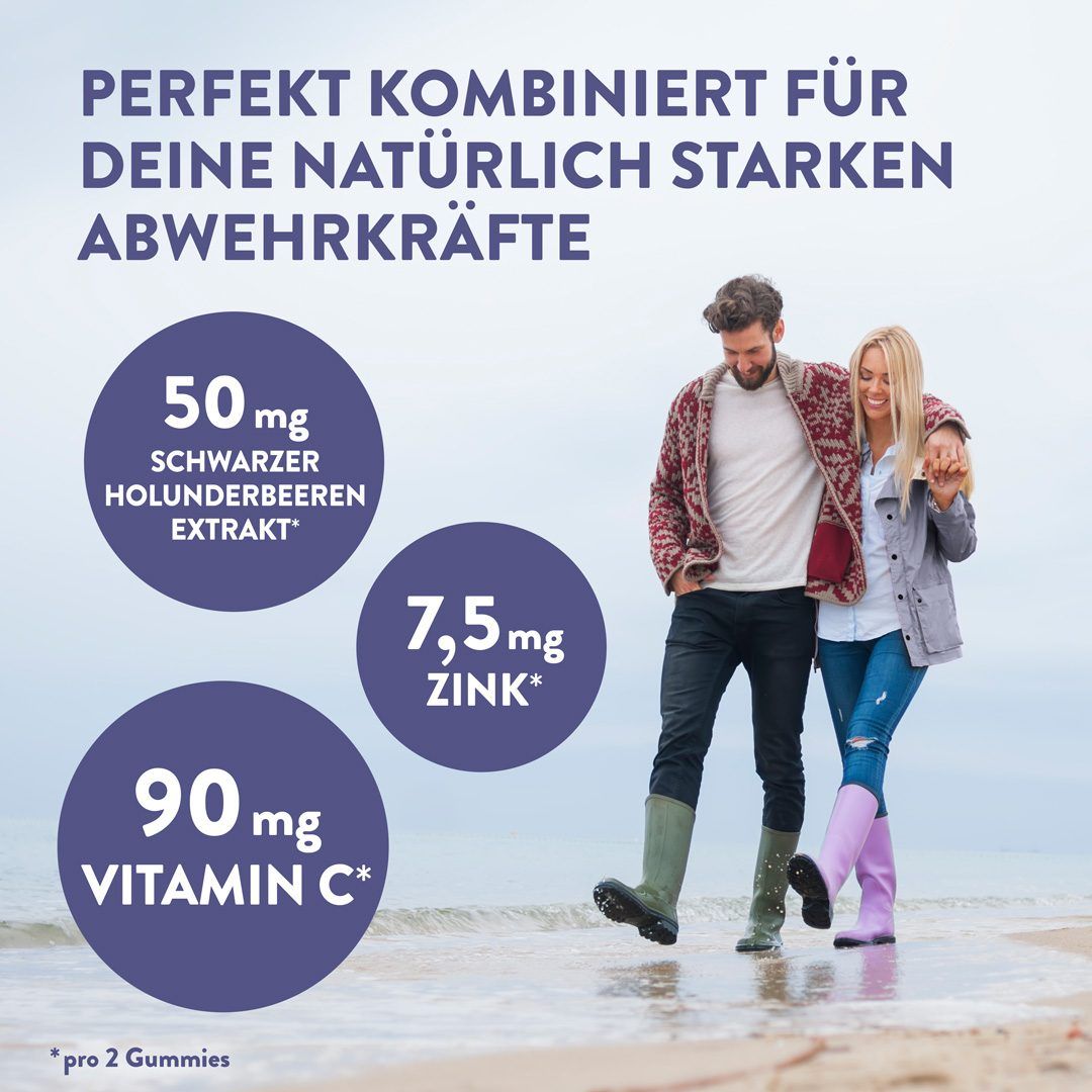 Paar am Strand. Text: 50mg Schwarzer Holunderbeeren Extrakt, 7,5mg Zink, 90mg Vitamin C. Text: pro 2 Gummies.