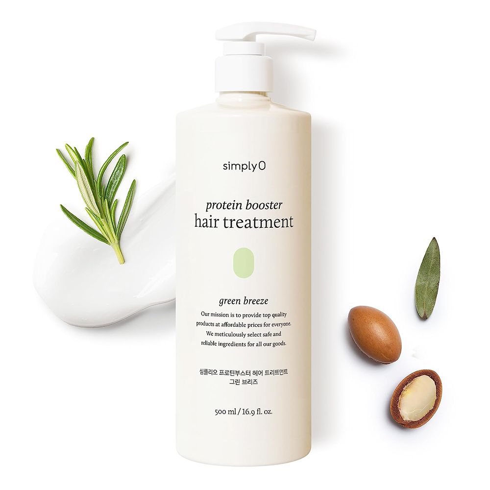 Weißer Spenderflakon mit Produktbezeichnung und grünen Akzenten. Neben dem Flakon sind Kräuter und Nüsse platziert.