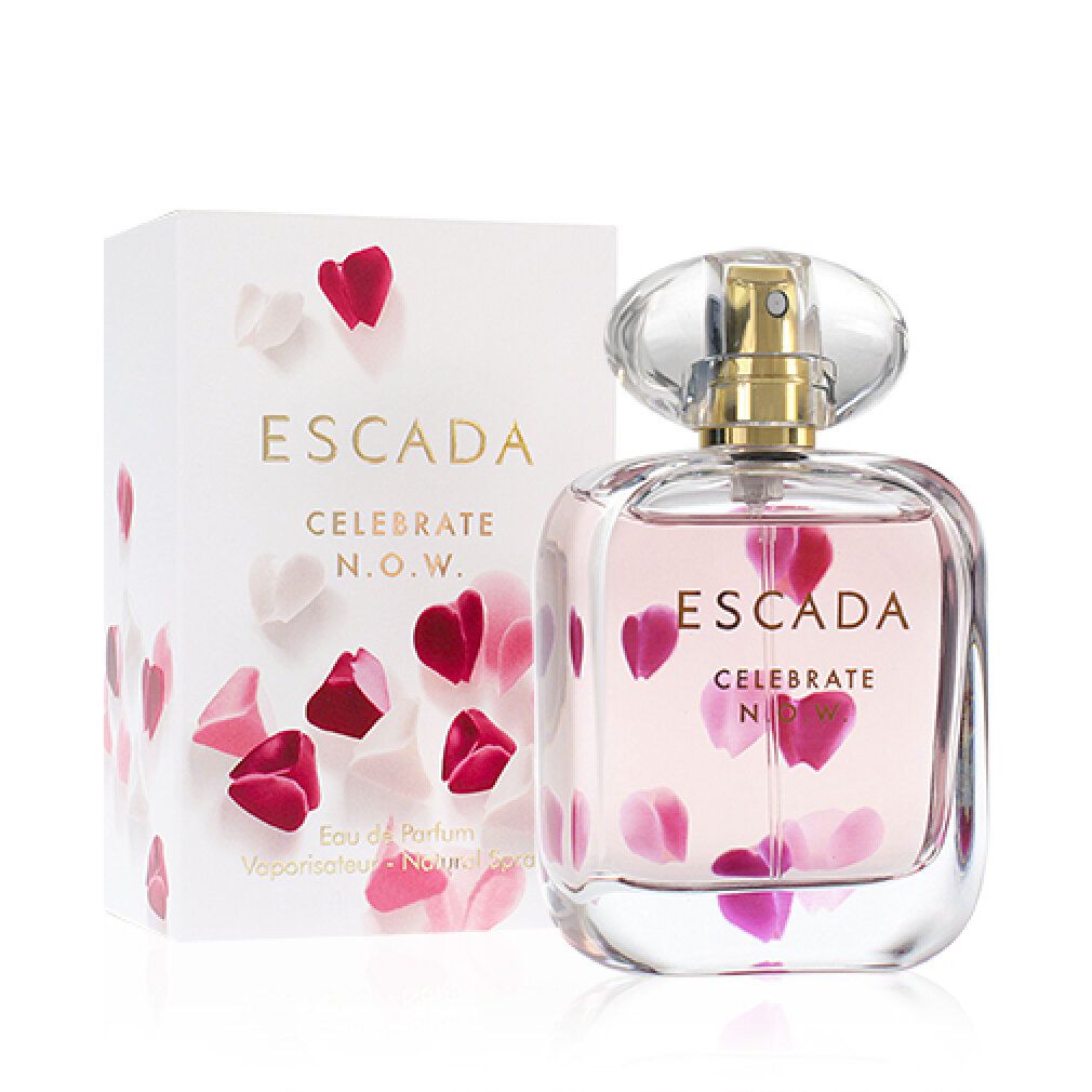 Parfümflakon und Verpackung. Flakon mit rosa Flüssigkeit und Blütenblättern. Verpackung mit Aufschrift: ESCADA CELEBRATE N.O.W.