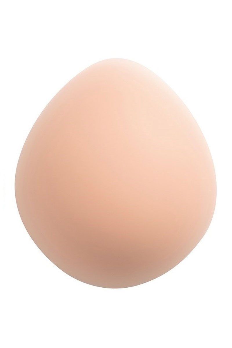 Ovale Brustprothese aus hautfarbenem Silikon. Glatte Oberfläche, tropfenförmig.