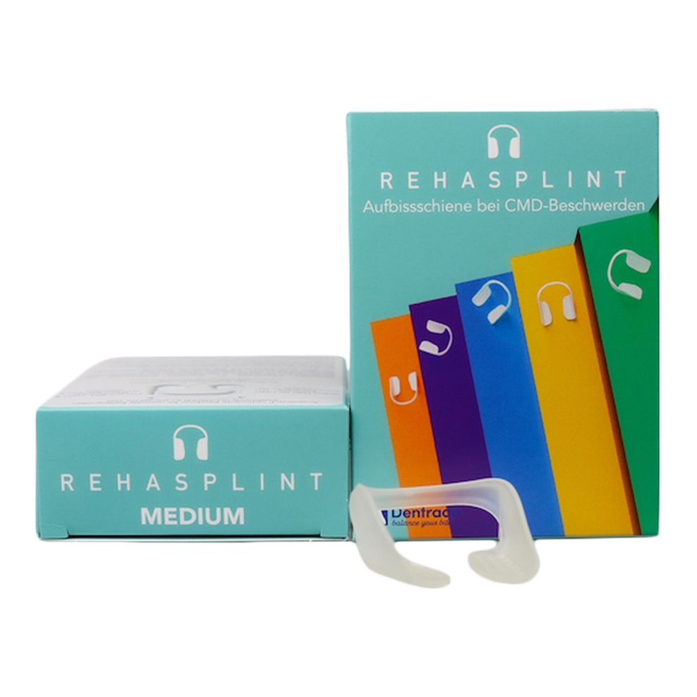 Zahnspange neben Verpackung. Auf der Verpackung steht REHASPLINT MEDIUM. Mehrere farbige Verpackungen sind im Hintergrund zu sehen.