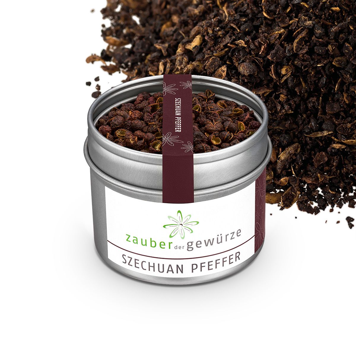 Geöffnete Dose mit Szechuan Pfeffer. Aufschrift: Zauber der Gewürze. Dunkelroter Streifen mit Aufschrift Szechuan Pfeffer. Pfeffer daneben.