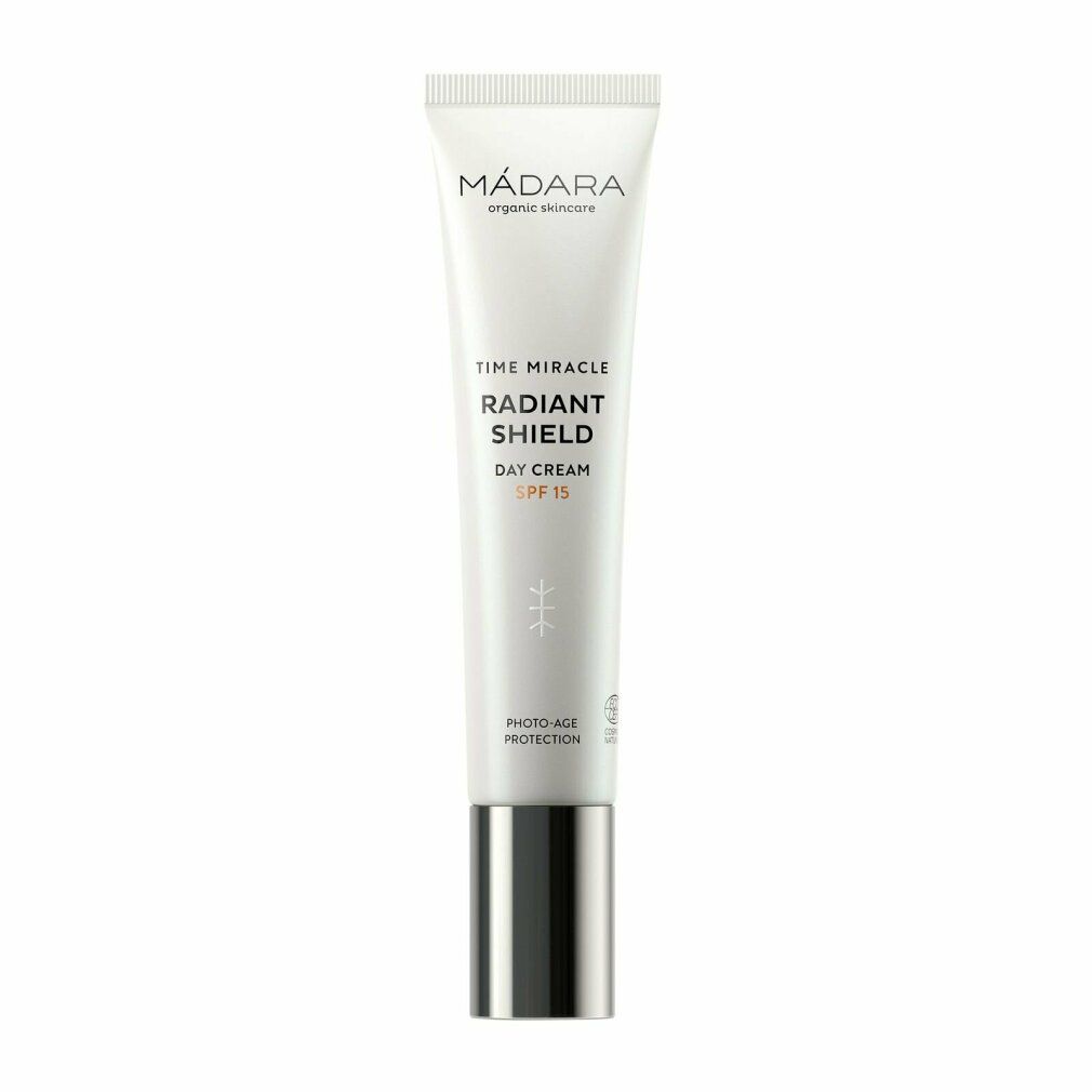 Creme-Tube mit Produktnamen und SPF15. Weiß, mit silberfarbenem Deckel. Marke: MÁDARA.