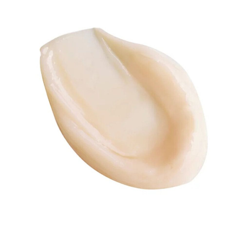 Creme-Abstrich. Beige Creme auf weißem Hintergrund.