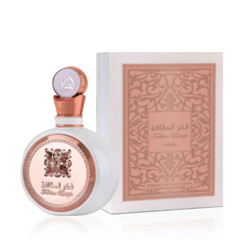 Weiße Schachtel und runde Flasche mit goldfarbenen Akzenten. Arabische Schriftzeichen und Logo. Auf der Schachtel steht 'Fakhar Lattafa'.