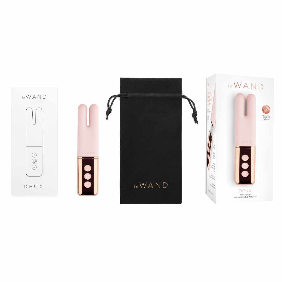 Produkt-Set: Vibrator, Beutel, Verpackung. Vibrator rosa, Beutel schwarz, Verpackung weiß. Marke: Le Wand.