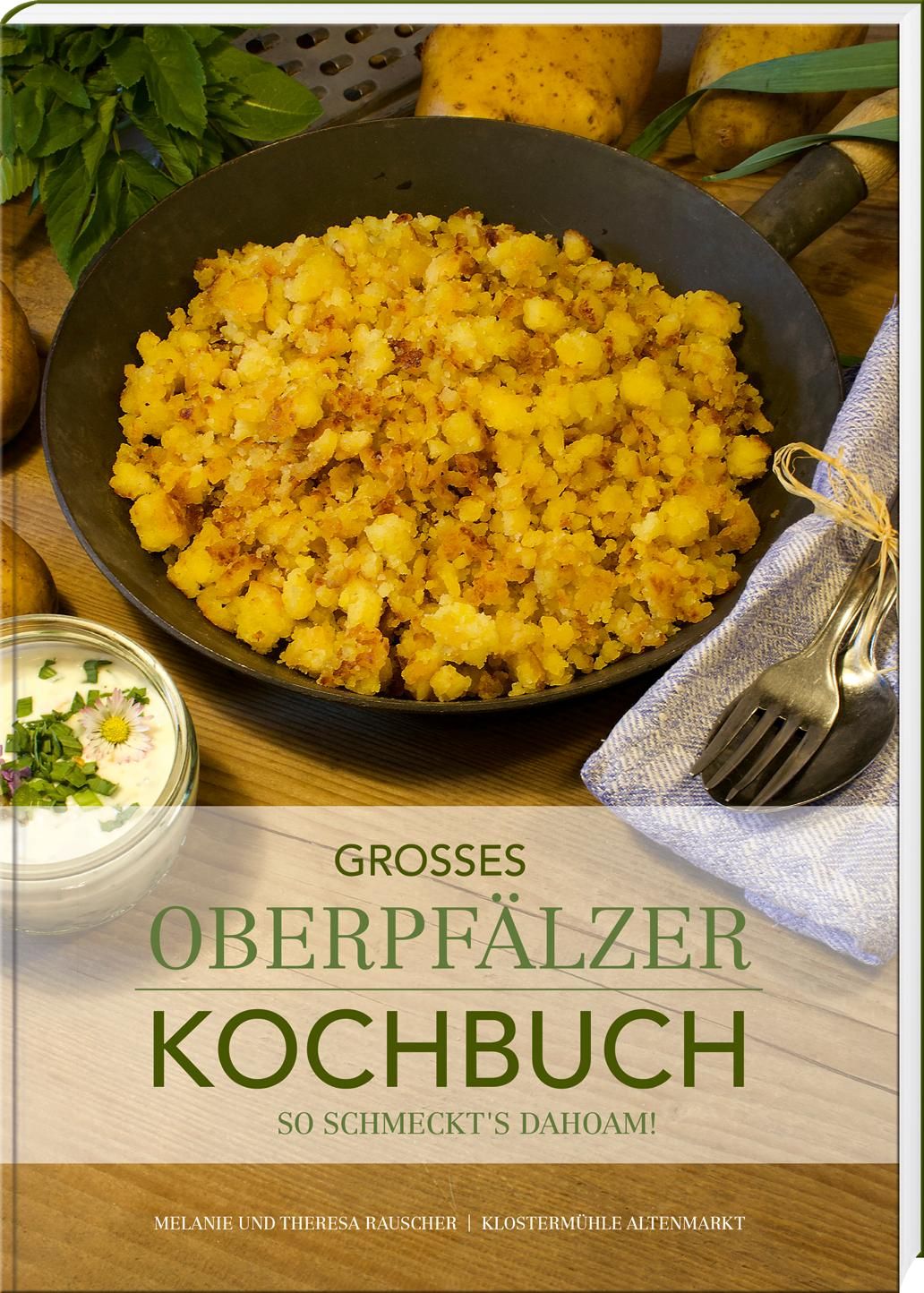 Kochbuch "Großes Oberpfälzer Kochbuch". Gebratene Speise in Pfanne, daneben Schüssel mit Dip, Besteck und Serviette.