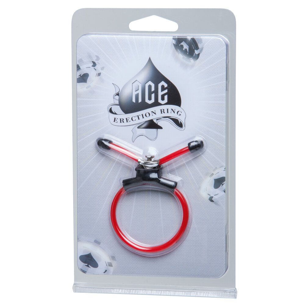 Erektionsring in Verpackung. Roter Ring mit schwarzem Halter und silbernem Element. Verpackung mit Logo 'ACE ERECTION RING'.