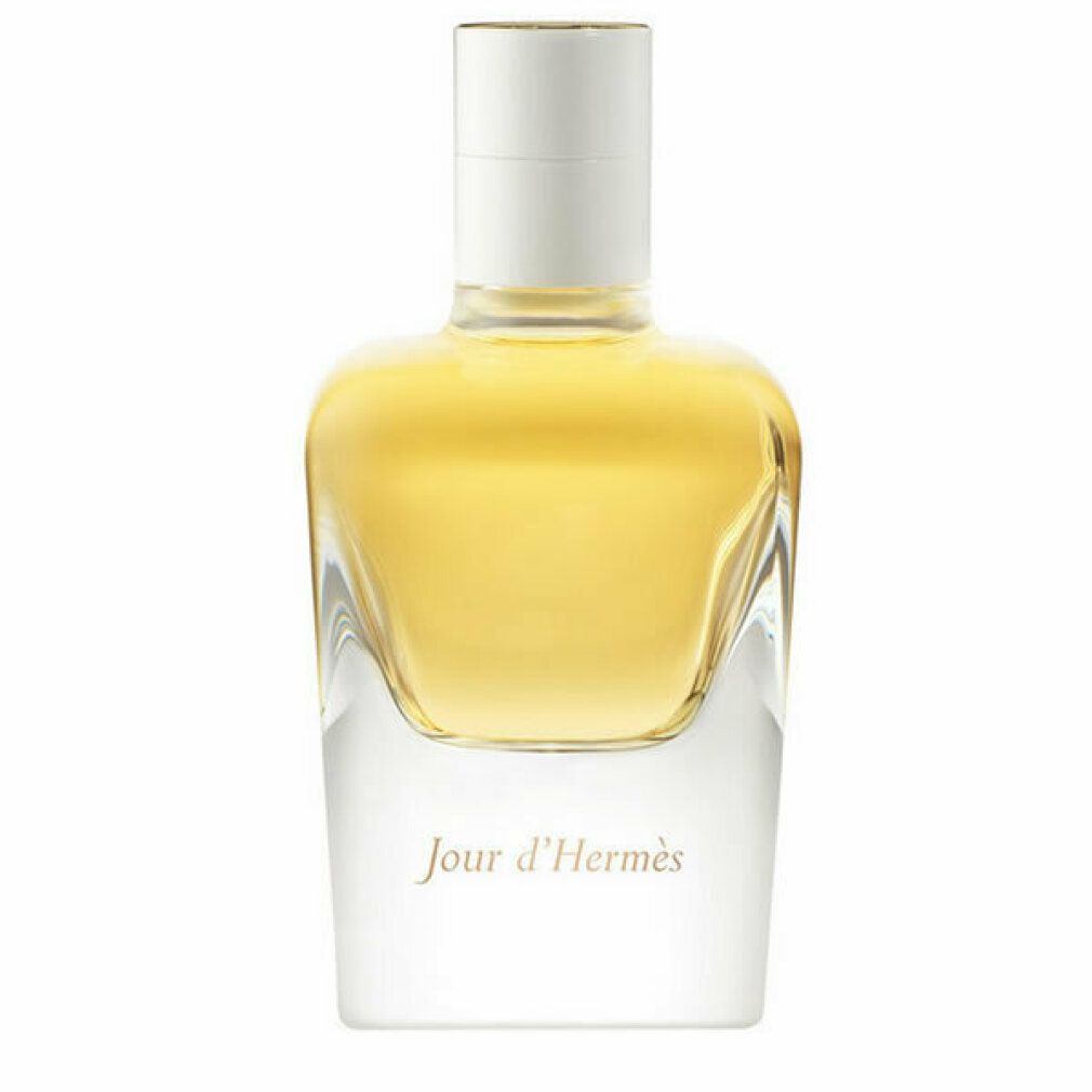 Glasflakon mit gelber Flüssigkeit. Weißer Verschluss. Schriftzug 'Jour d'Hermès'.