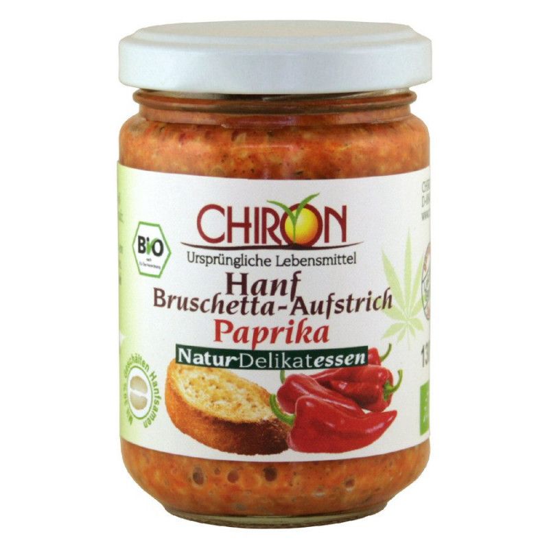 Glas mit Aufstrich. Etikett mit "CHIRON Hanf-Bruschetta Paprika", Bio-Siegel, Abbildung von Paprika und Brot.