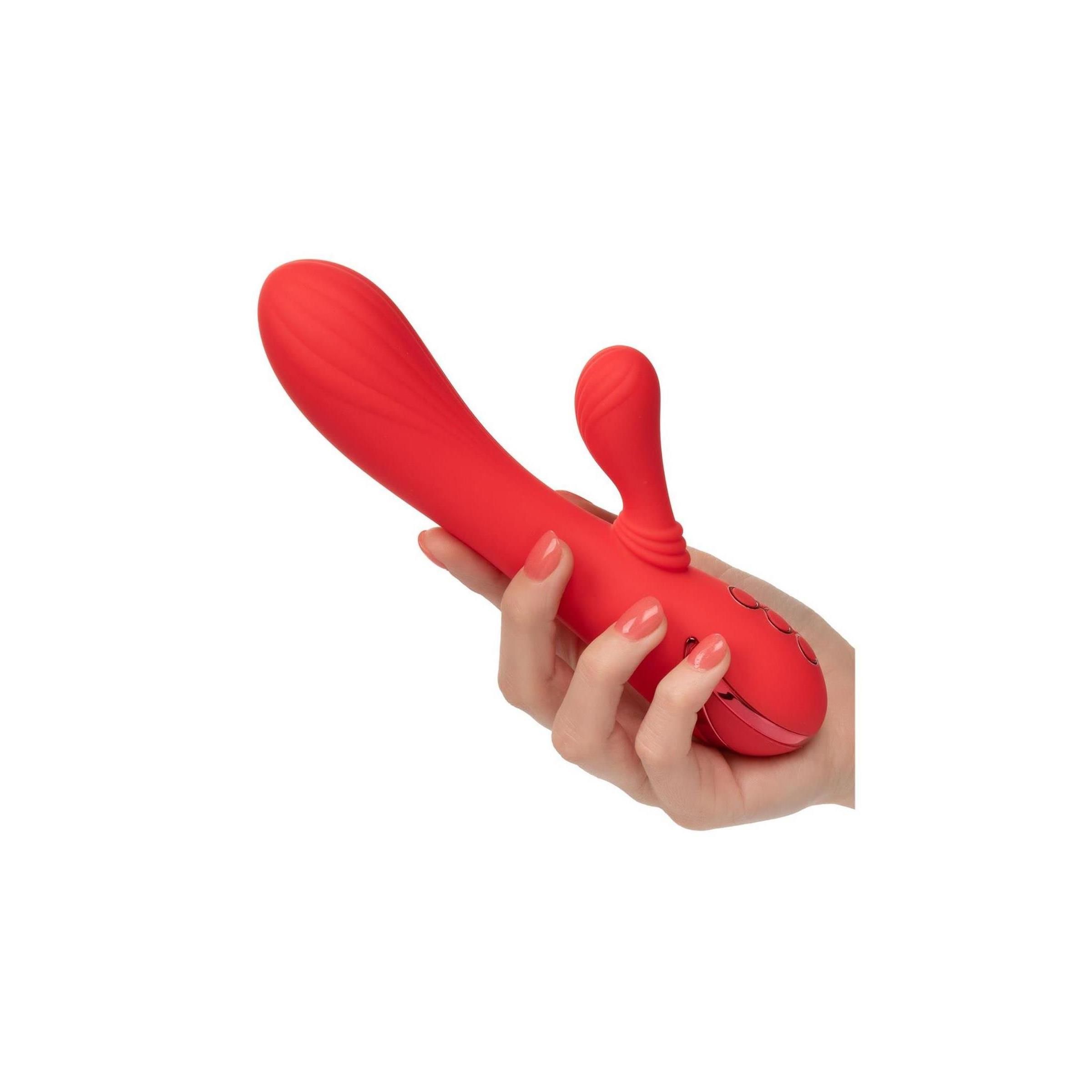 Roter Vibrator in einer Hand gehalten. Sichtbare Knöpfe und Form.