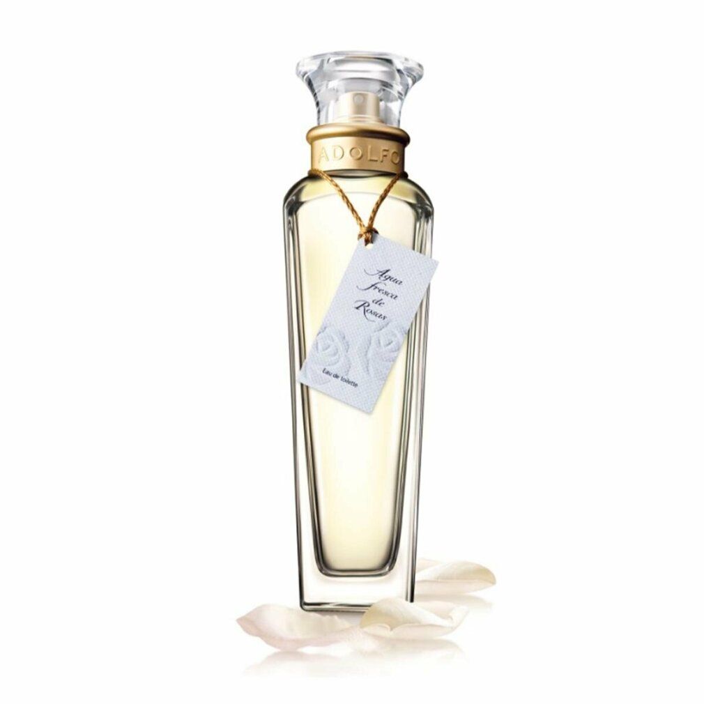Adolfo Dominguez Agua Fresca De Rosas Eau De Toilette Spray. Flakon mit Etikett und Verschluss. Rosenblätter liegen am Boden.