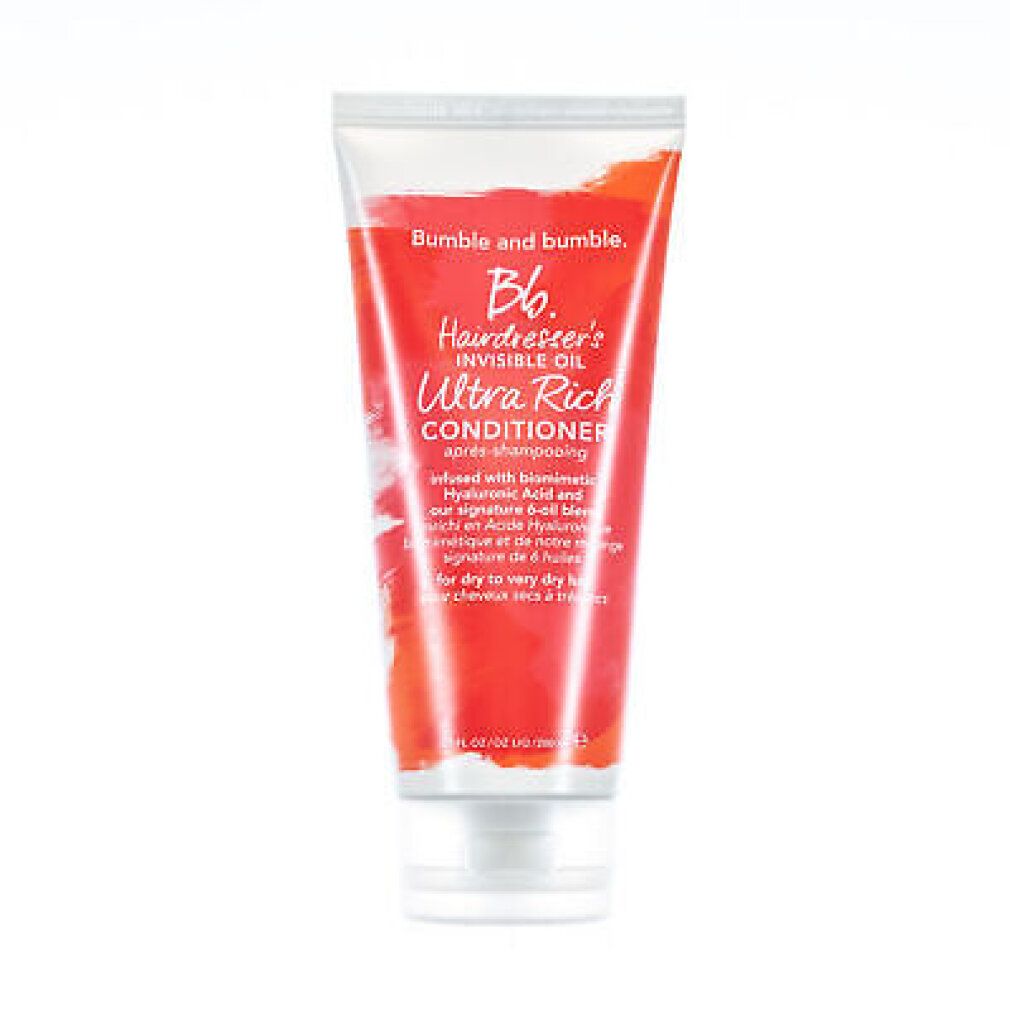 Transparente Tube mit roter Flüssigkeit. Aufschrift: Bumble and bumble, Hairdresser's Invisible Oil Ultra Rich Conditioner.