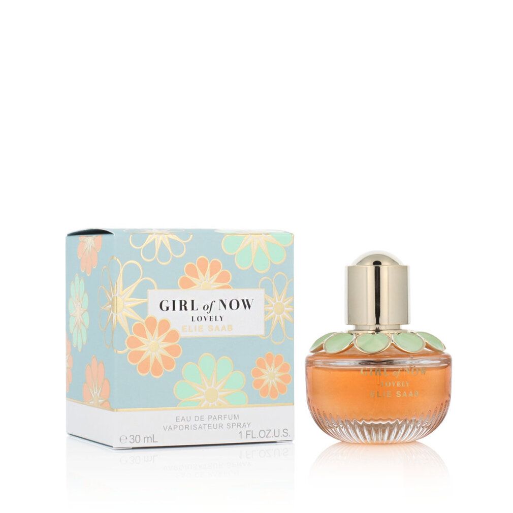 Parfümflasche und Schachtel. Flasche mit goldener Kappe, orangefarbener Flüssigkeit, grünen Blütenblättern. Schachtel mit Blumenmuster.