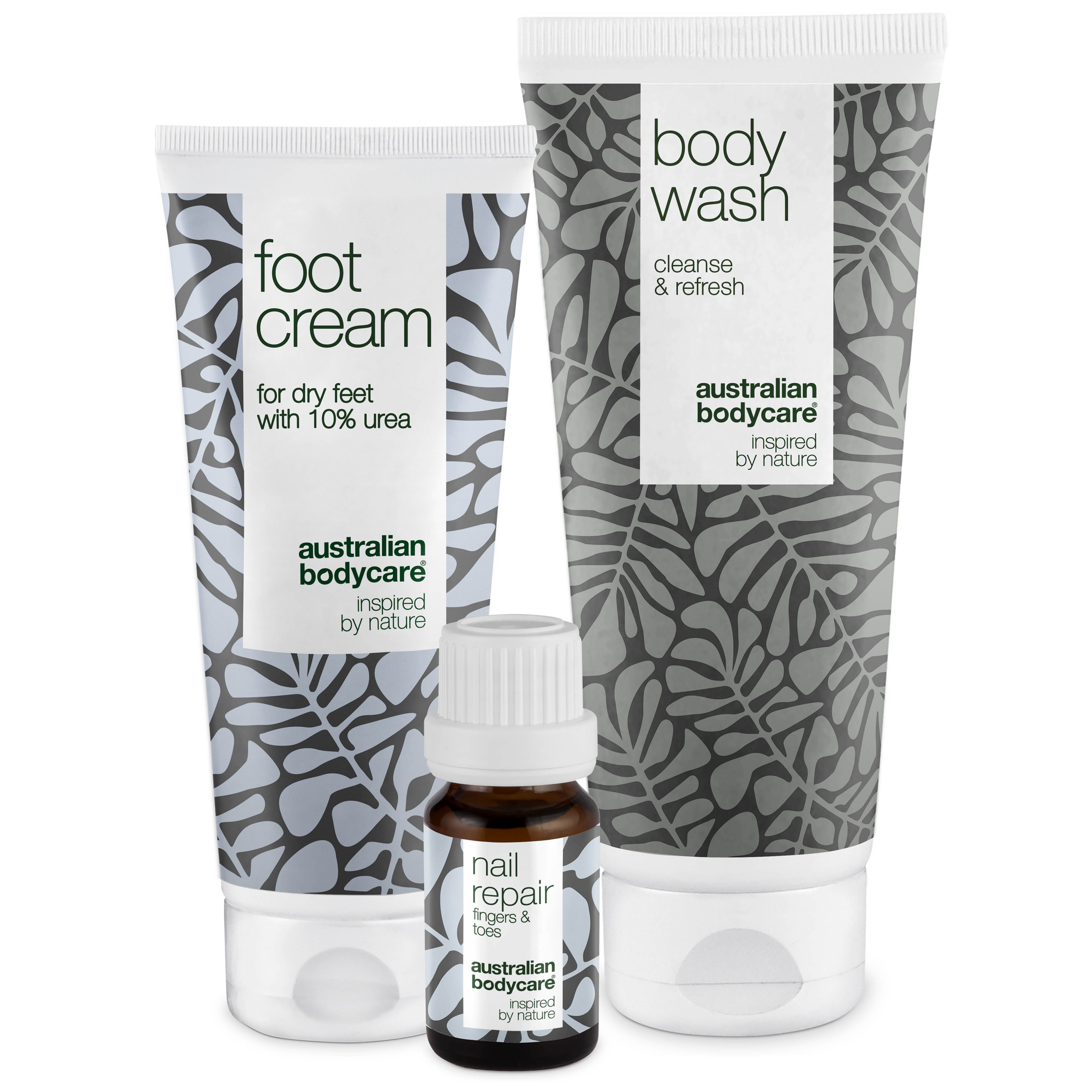 Fußcreme, Body Wash und Nagelreparatur-Öl. Produkte mit weißer Tube und grauen Blättern. Australian Bodycare.