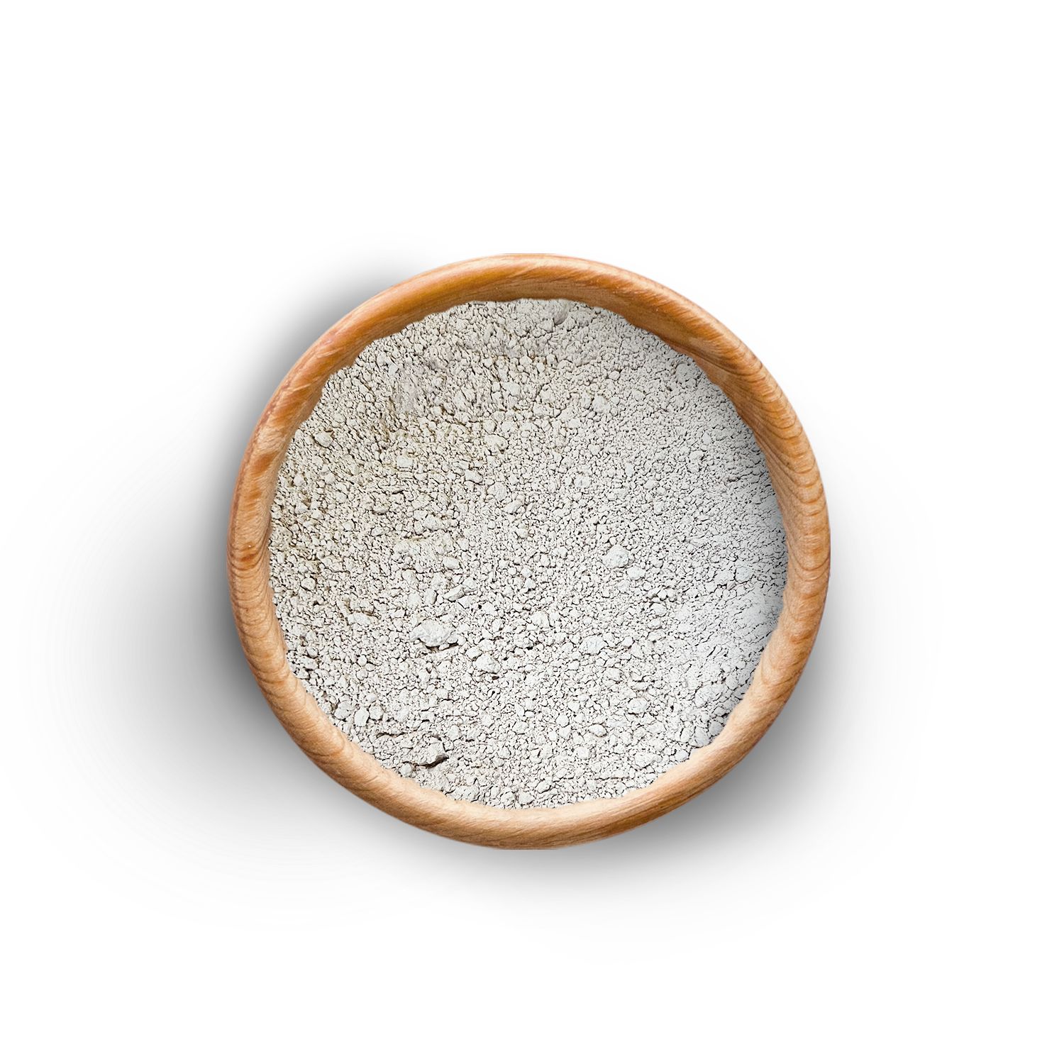Holzschale mit grauem Pulver. Der Hintergrund ist weiß.
