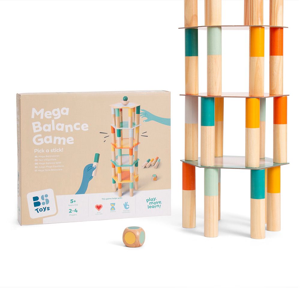 Das Spiel 'Mega Balance Game' mit Verpackung und aufgebautem Turm. Die Verpackung zeigt das Spiel. Ein Würfel liegt daneben.