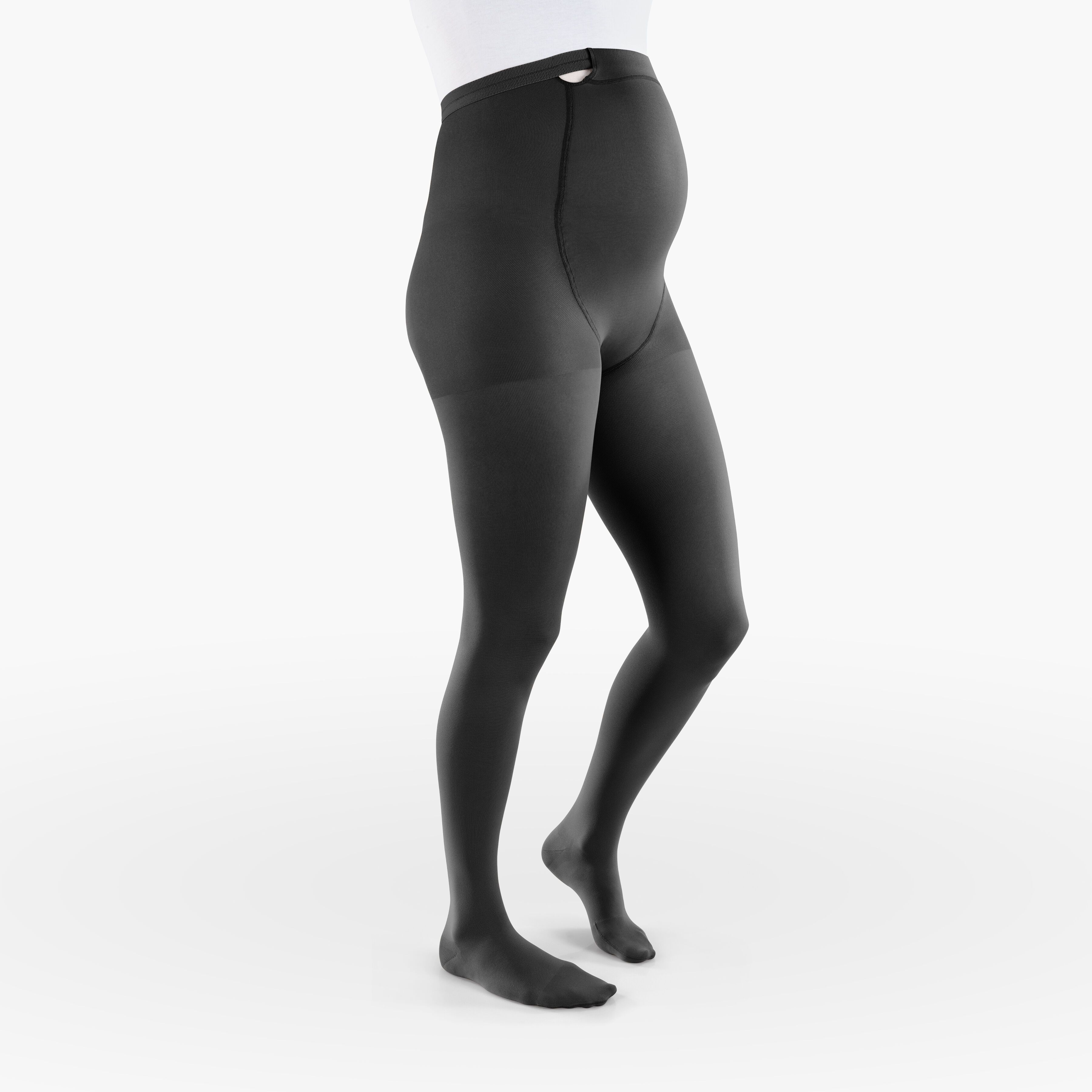 Schwarze Kompressionsstrumpfhose für Schwangere. Hoher Bund, bedeckt den Bauch. Blick von der Seite.