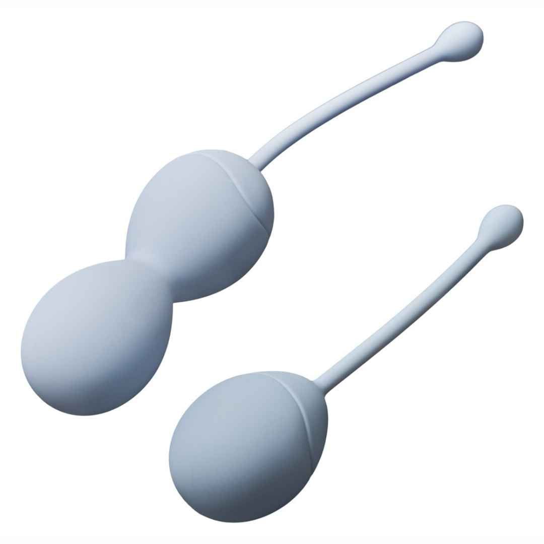 Zwei hellgraue Beckenbodenkugeln mit Stiel. Eine Kugel ist doppelt, die andere einfach.