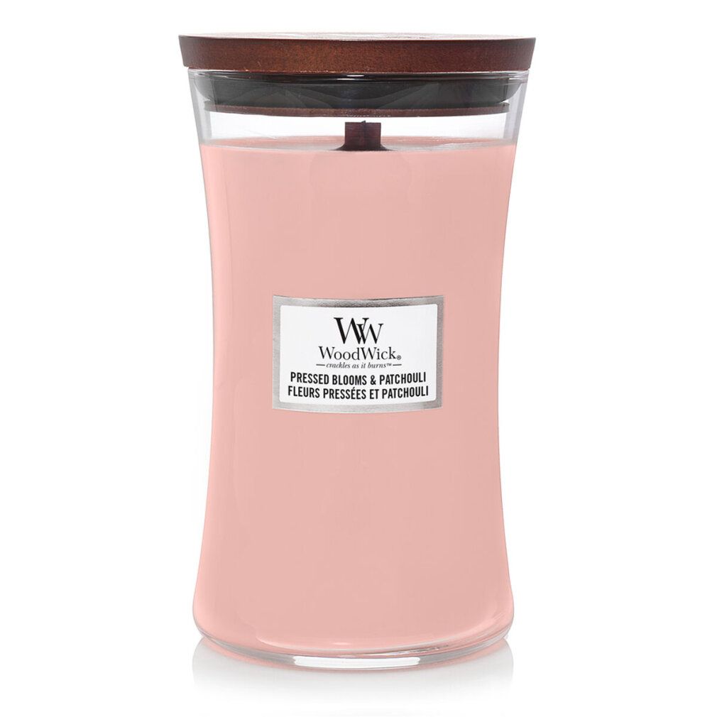 Rosa Kerze mit Holzdocht und Deckel. Aufkleber mit Logo und Produktnamen. Glasbehälter mit geschwungener Form.
