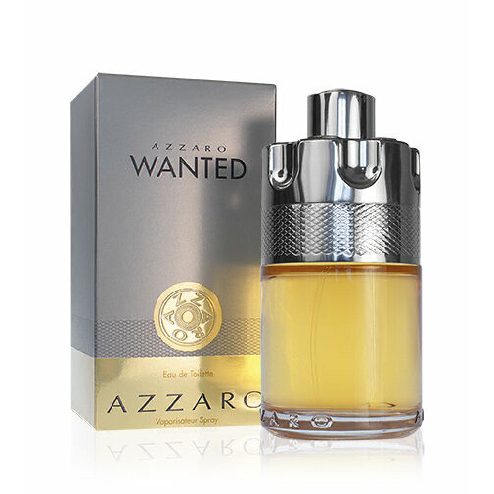 Azzaro Wanted Eau de Toilette Flakon und Schachtel. Flakon mit silberfarbenem Verschluss, gelber Flüssigkeit. Graue Schachtel daneben.