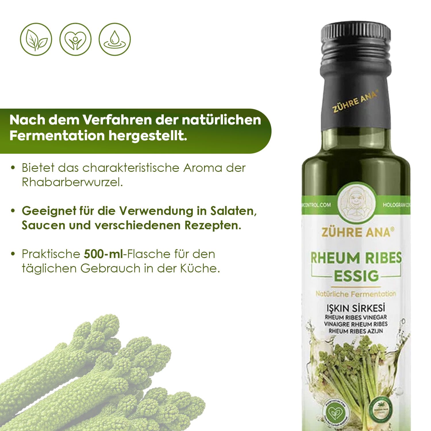 Flasche Zühre Ana Rheum Ribes Essig neben Rhabarberwurzeln. Text auf Deutsch: "Nach dem Verfahren der natürlichen Fermentation hergestellt."