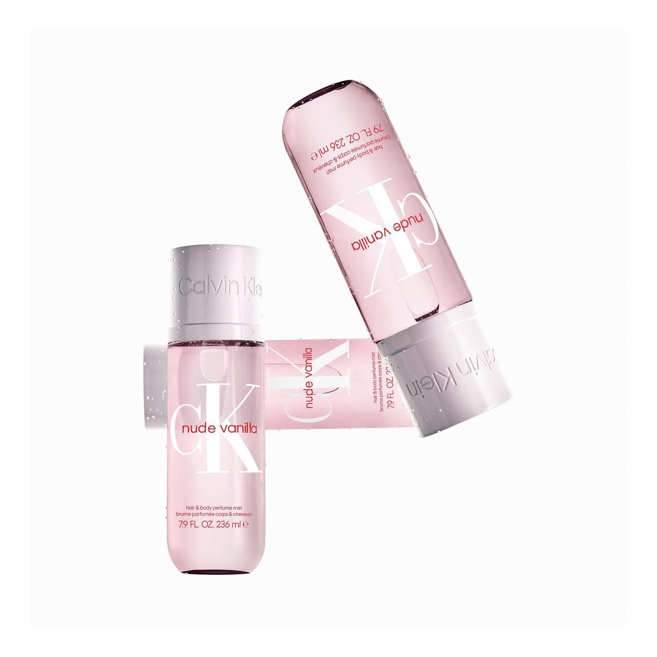 Drei rosa Flaschen mit weißem Deckel. Aufschrift "nude vanilla" und "Calvin Klein".