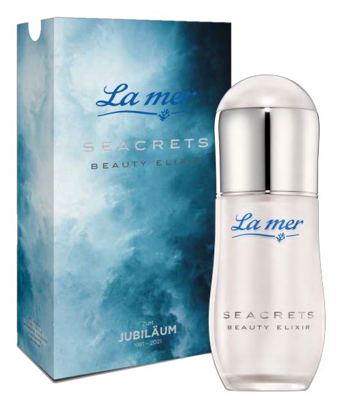 Elixier-Flasche mit silbernem Deckel und Verpackung. Aufschrift: La mer, Seacrets Beauty Elixir. Jubiläum 1981-2021.