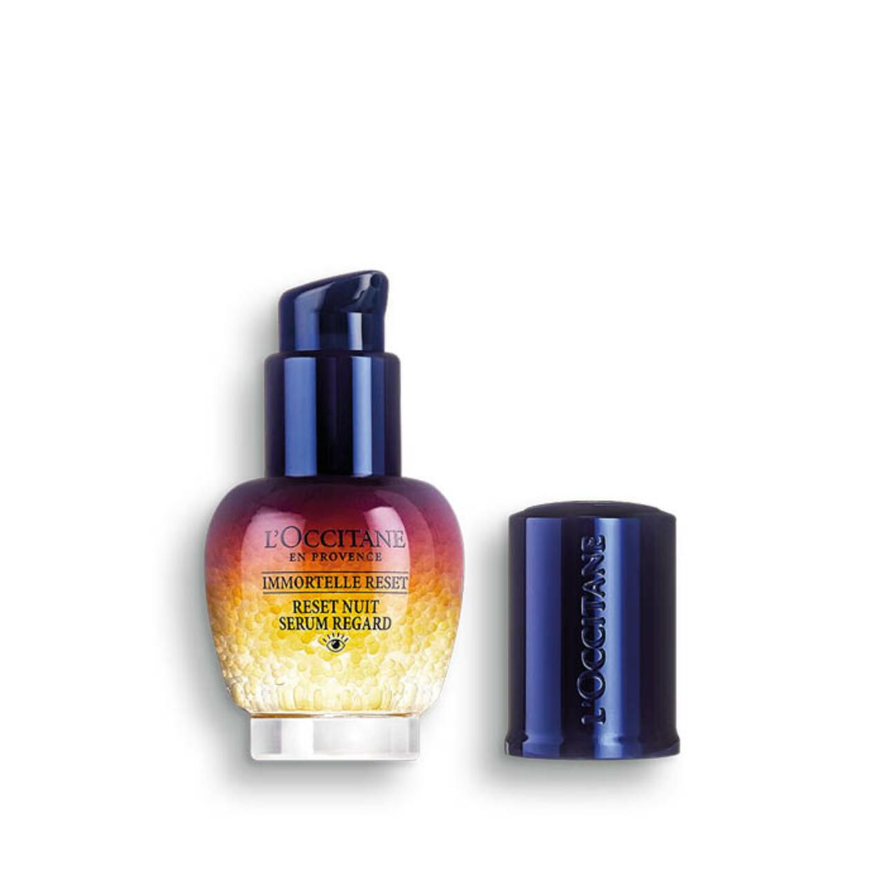Flasche mit blauem Deckel, geöffnet. Farbverlauf von Rot nach Gelb. Text: Immortelle Reset Serum Regard.