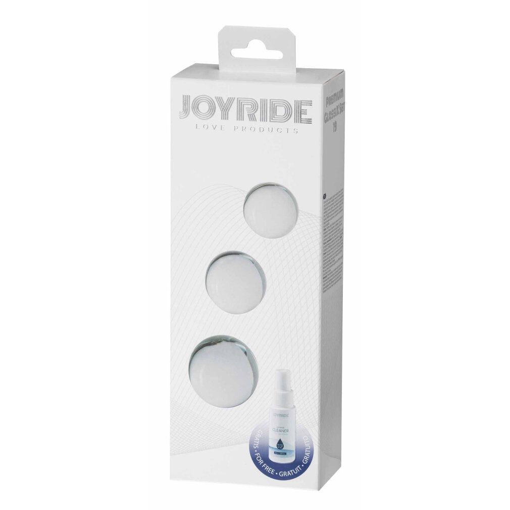 Verpackung mit drei Glas-Dildos und einer Sprühflasche. JOYRIDE-Logo auf der Verpackung. Produktname nicht sichtbar.