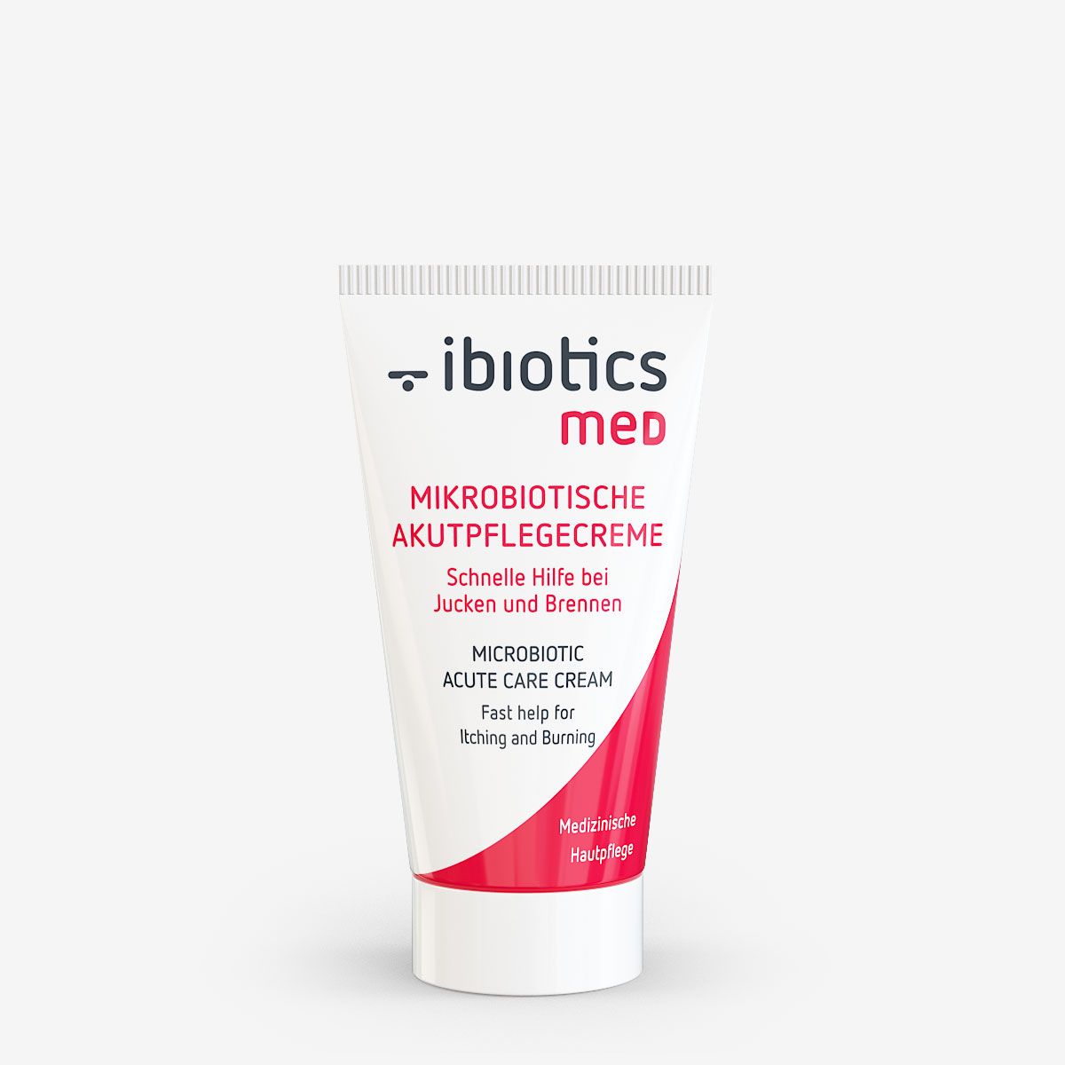 Weiße Tube mit rotem Akzent. Beschriftung: Ibiotics med, Mikrobiotische Akutpflegecreme, schnelle Hilfe bei Jucken und Brennen.