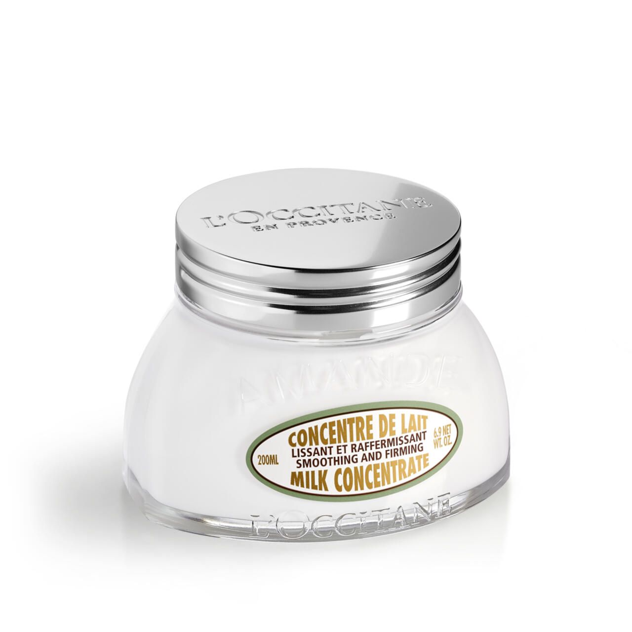 Weißes Creme-Glas mit silbernem Deckel. Aufschrift: CONCENTRE DE LAIT, MILK CONCENTRATE. Marke L'Occitane.