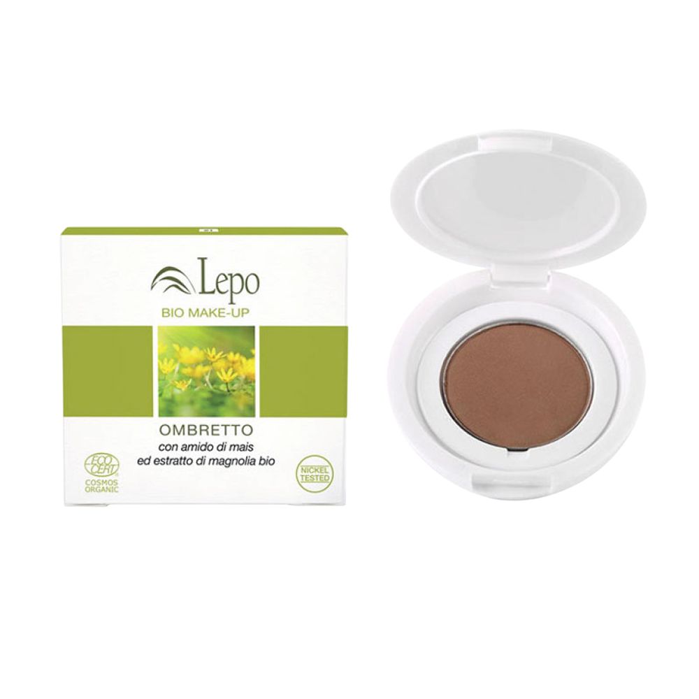 L'immagine mostra un prodotto LEPO OMBRETTO. È composto da un ombretto rotondo bianco con un ombretto marrone e una confezione bianca. La confezione mostra il logo LEPO, la scritta "BIO MAKE-UP" e la denominazione "OMBRETTO".