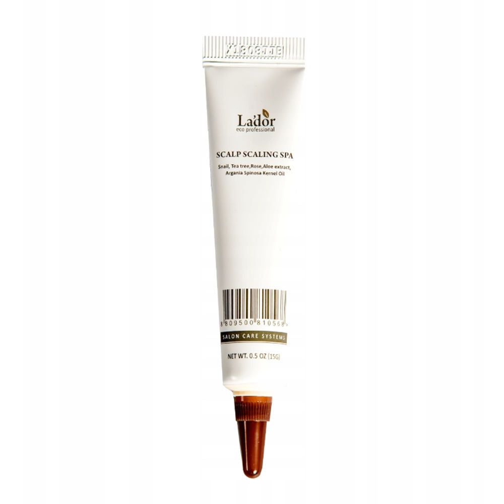 Weiße Tube mit brauner Spitze. Aufschrift: Lador, Scalp Scaling Spa. Barcode und Nettoinhalt 0.5 OZ (15g).